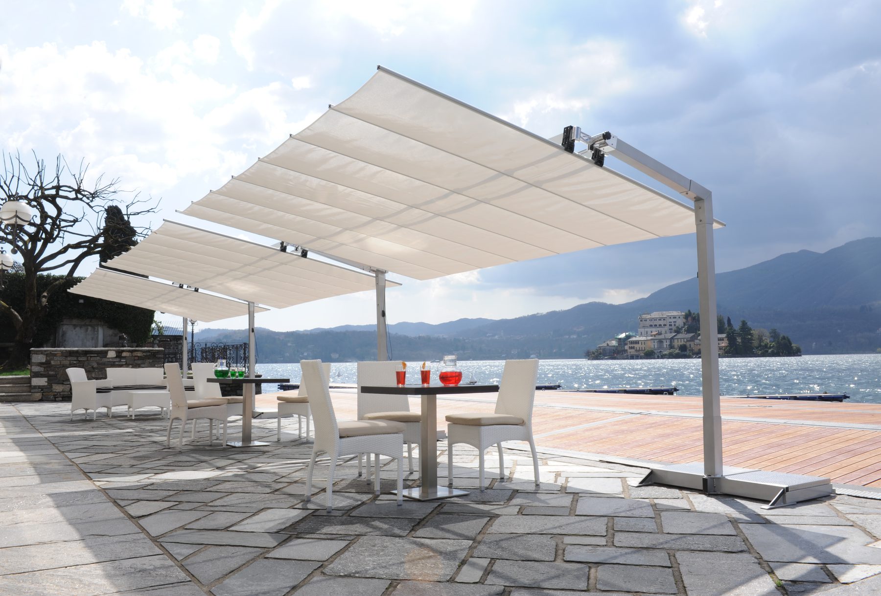 FIM Flexy freestanding awning shading a residential lakefront patio