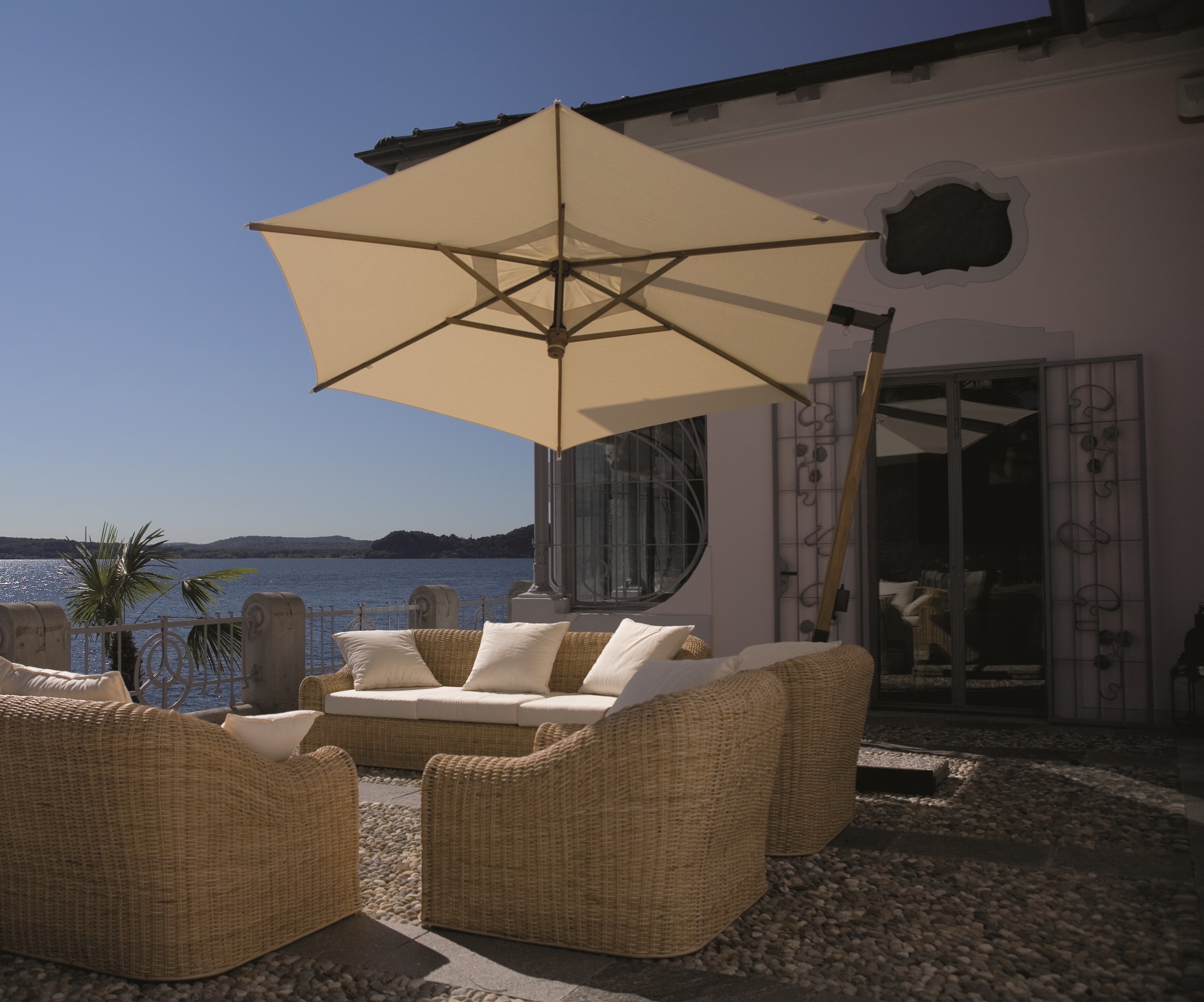 FIM Ischia C05 10.5 ft hexagonal cantilever umbrella — lakeside terrace installation